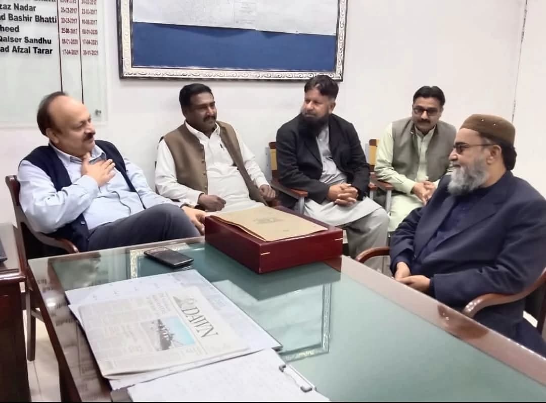 HRPF representatives meeting at an office table.